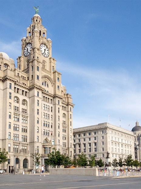Liver Building and waterfront in Liverpool, United Kingdom, part of hop-on hop-off tour.