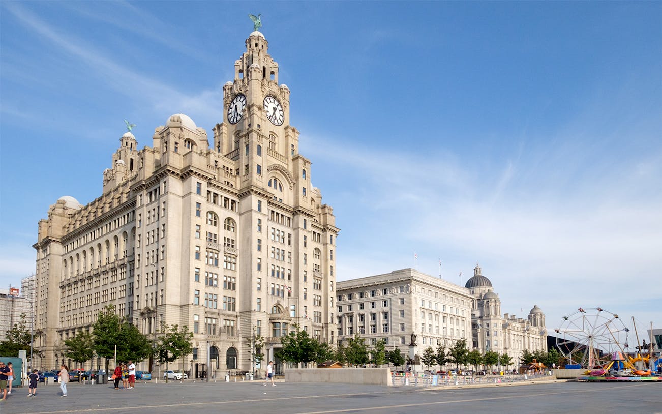 Liver Building and waterfront in Liverpool, United Kingdom, part of hop-on hop-off tour.