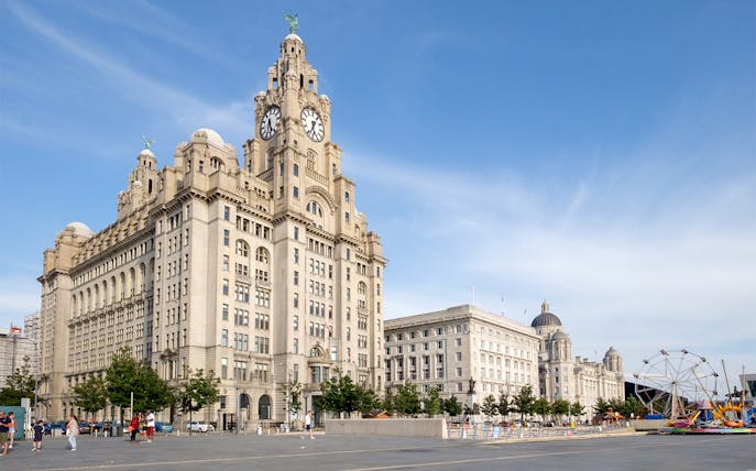 Liver Building and waterfront in Liverpool, United Kingdom, part of hop-on hop-off tour.