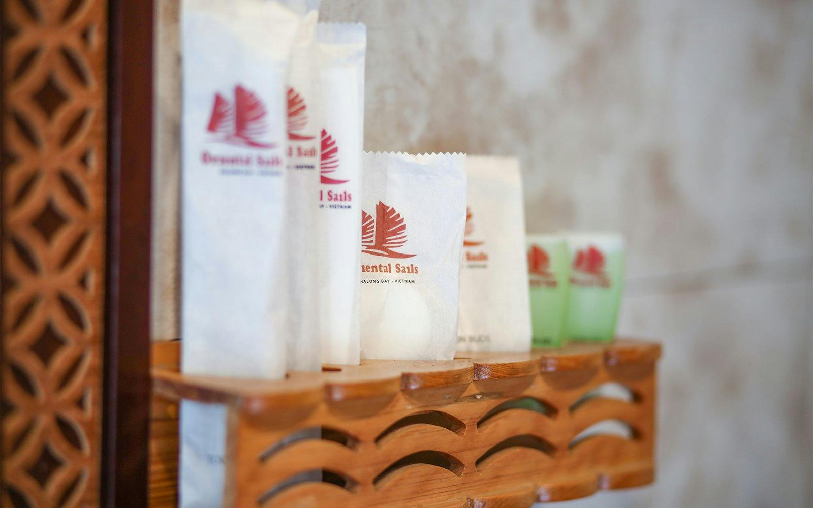 Halong Bay cruise toiletries on wooden shelf, Vietnam.