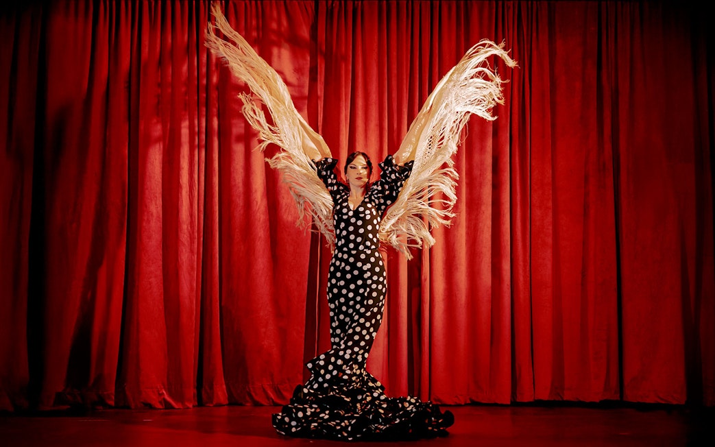 Flamenco dancer with shawl on stage at Laietana, Barcelona.