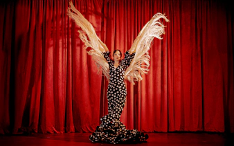 Flamenco dancer with shawl on stage at Laietana, Barcelona.