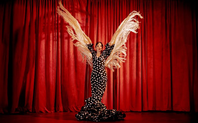 Flamenco dancer with shawl on stage at Laietana, Barcelona.
