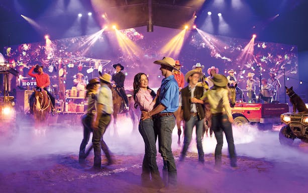 Performers in cowboy attire at Australian Outback Spectacular Heartland Dinner & Show.
