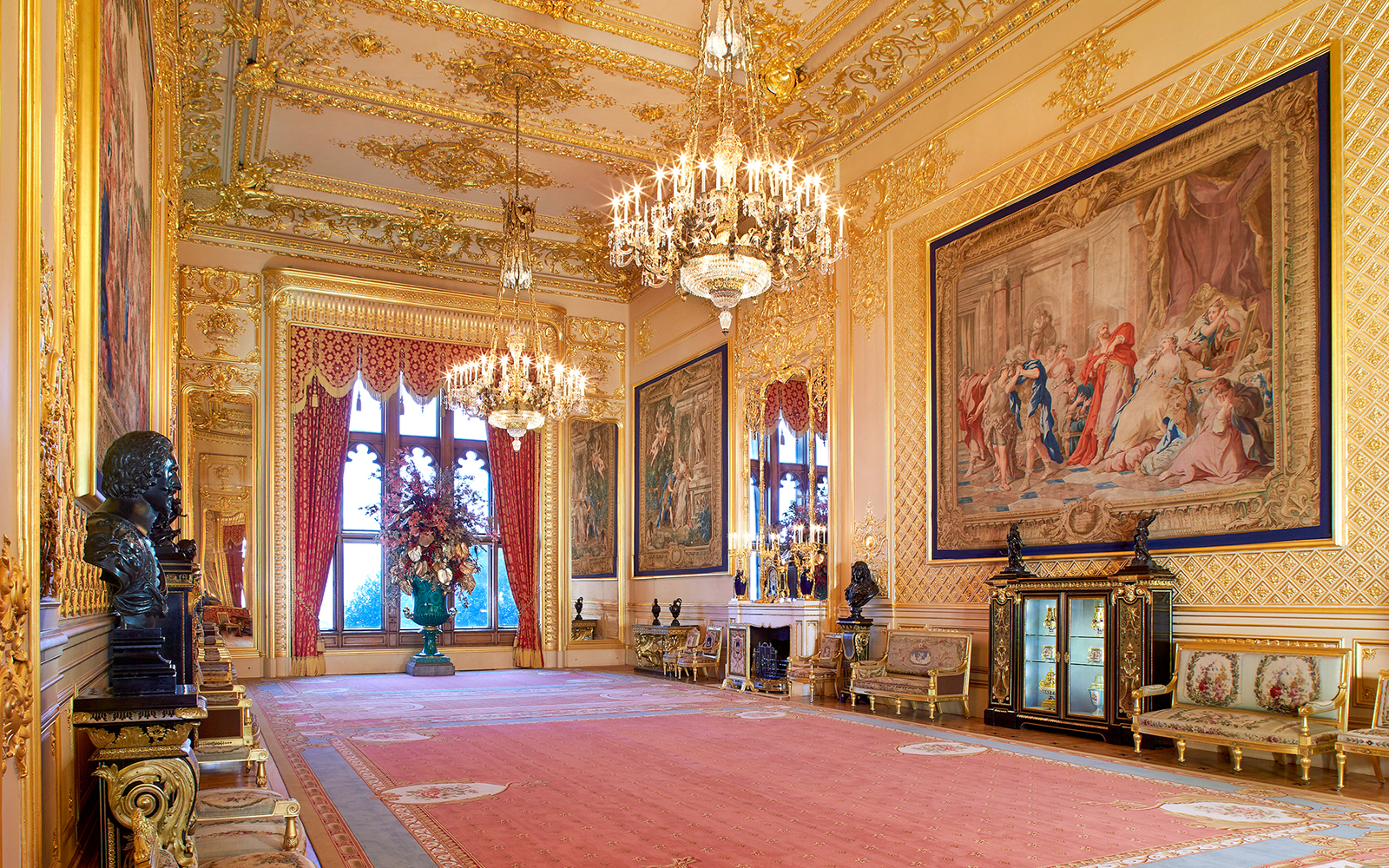 Grand Reception Room in Windsor Castle with chandeliers and ornate tapestries.