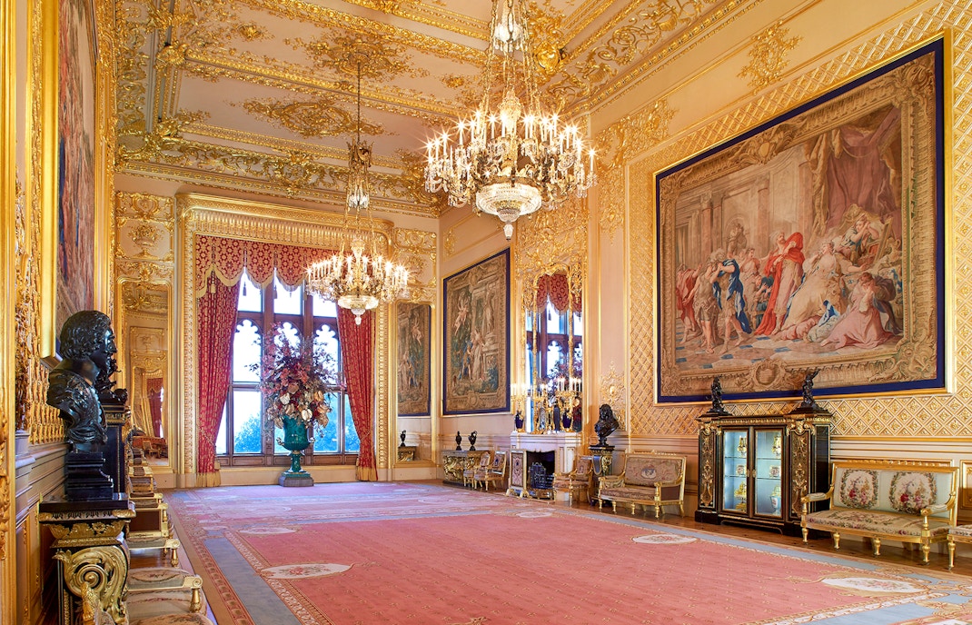 Grand Reception Room in Windsor Castle with chandeliers and ornate tapestries.