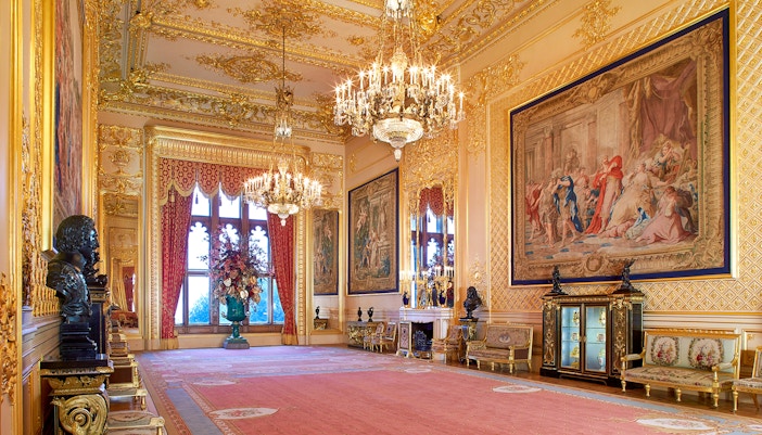 Grand Reception Room in Windsor Castle with chandeliers and ornate tapestries.