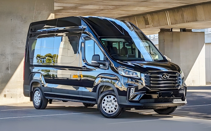 Luxury transfer bus for Great Ocean Road Reverse Tour parked under a bridge.