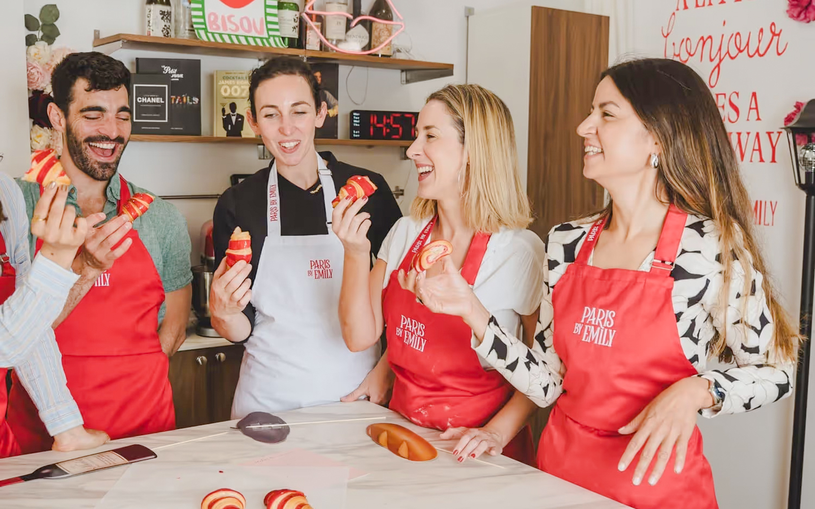 People enjoying croissant-making at Emily in Paris workshop.