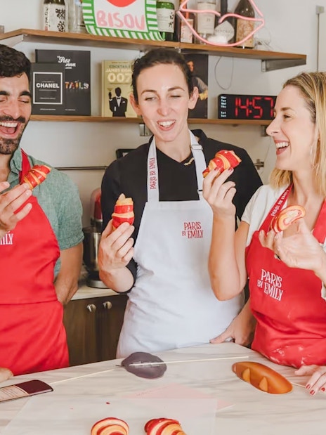 People enjoying croissant-making at Emily in Paris workshop.