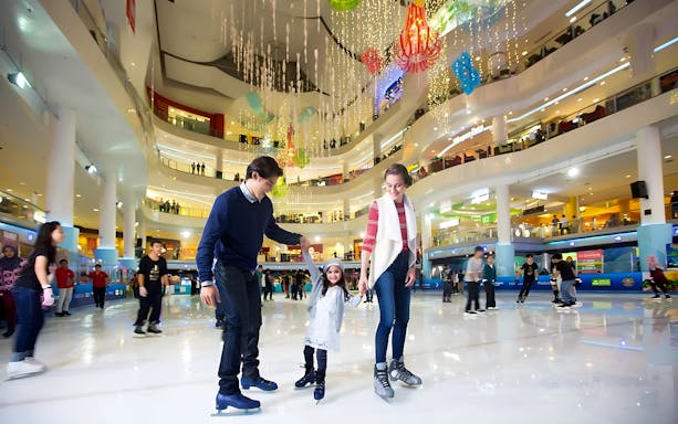 Family ice skating at Sunway Pyramid in Kuala Lumpur.