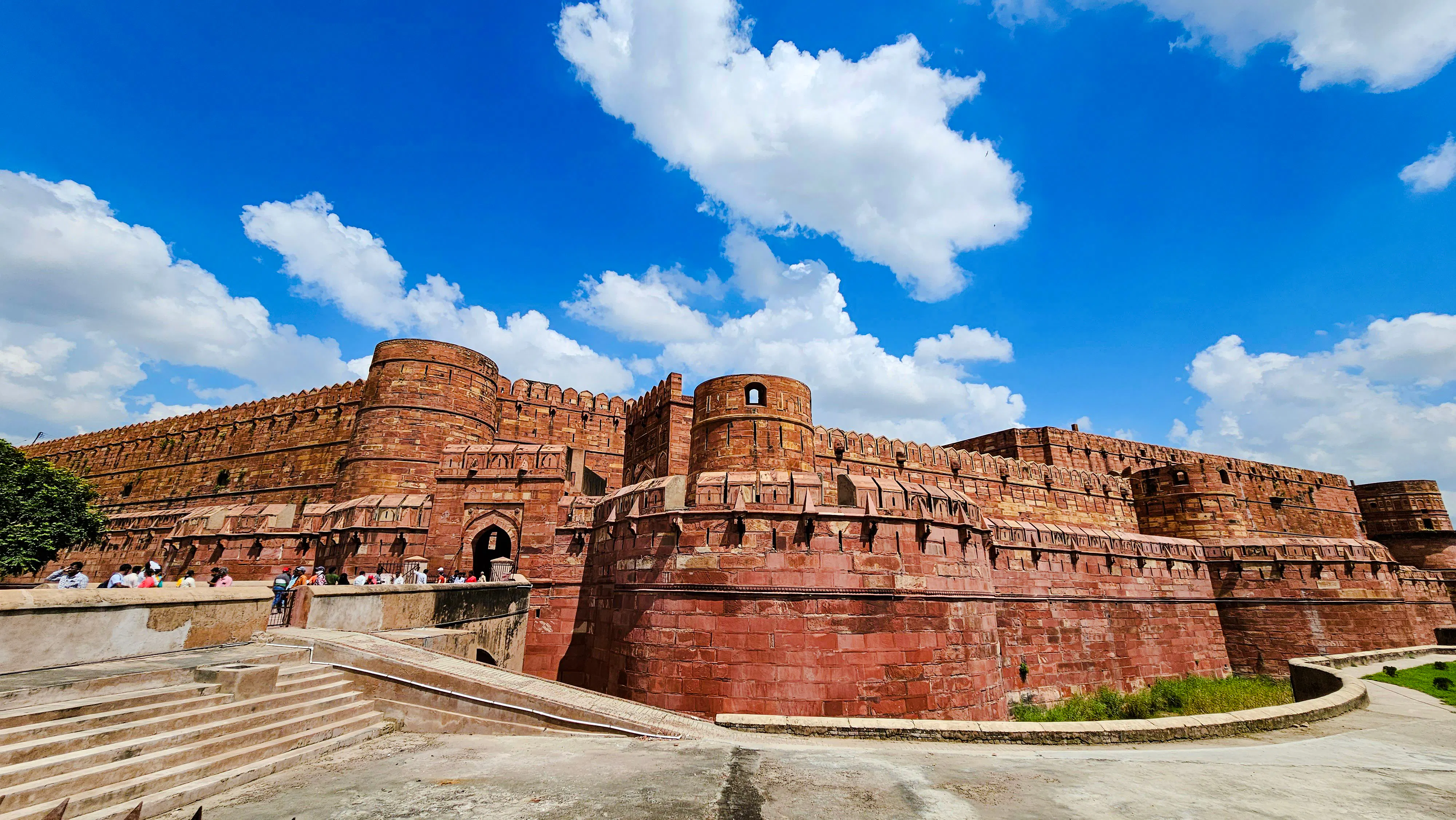 Agra Fort with red sandstone walls under blue sky, part of 2 Days Delhi & Agra Private Tour.