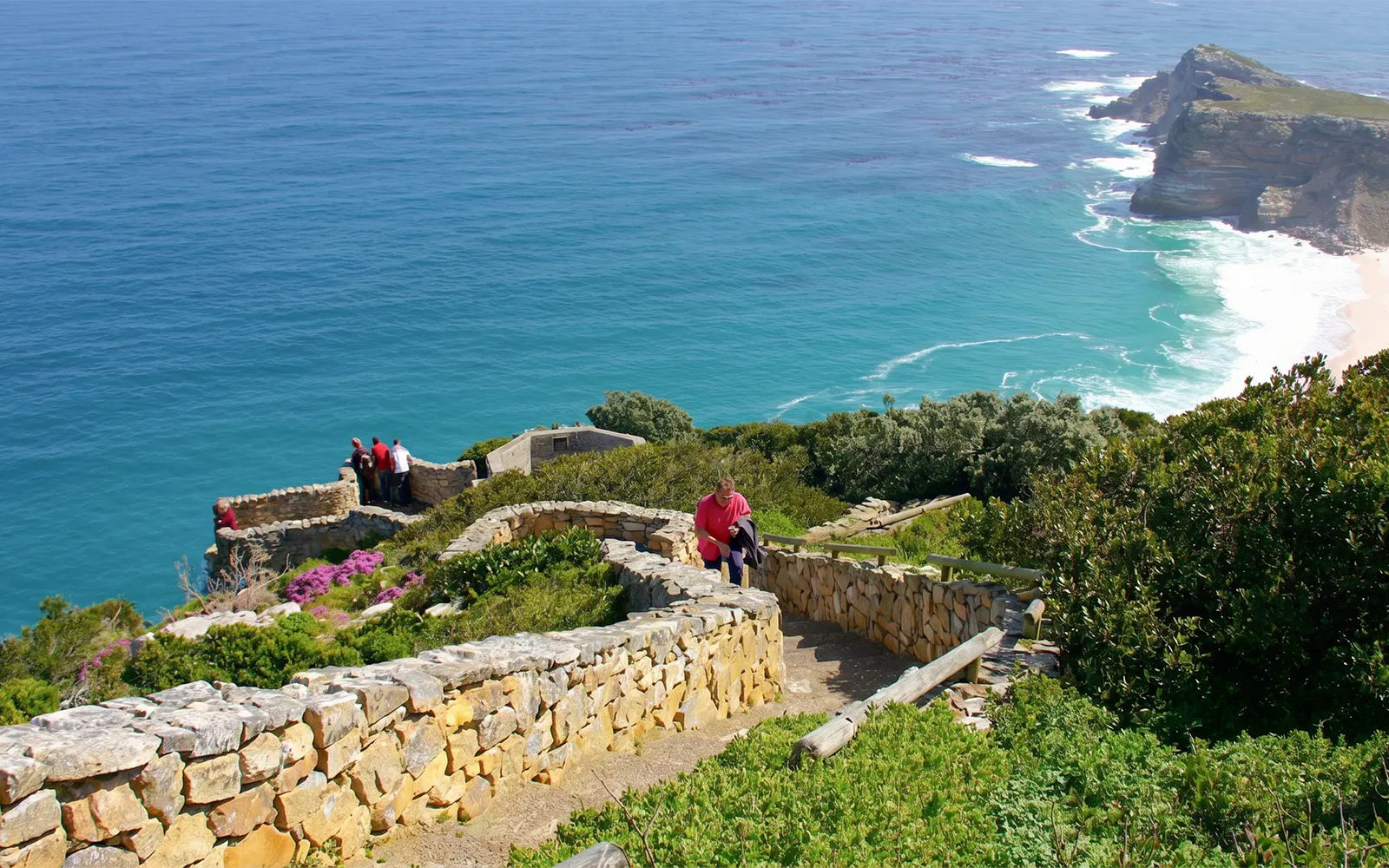 Visitors enjoying ocean views from Cape Point, Cape Town.