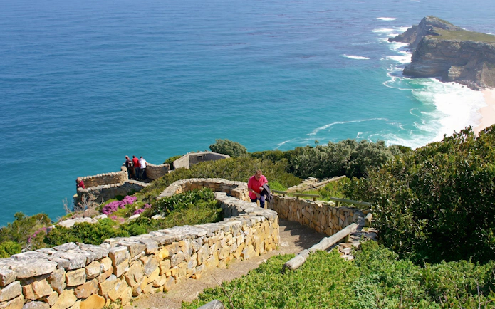 Visitors enjoying ocean views from Cape Point, Cape Town.