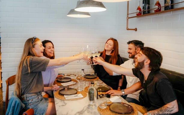 Group enjoying wine at a table during Lisbon Food Tour.
