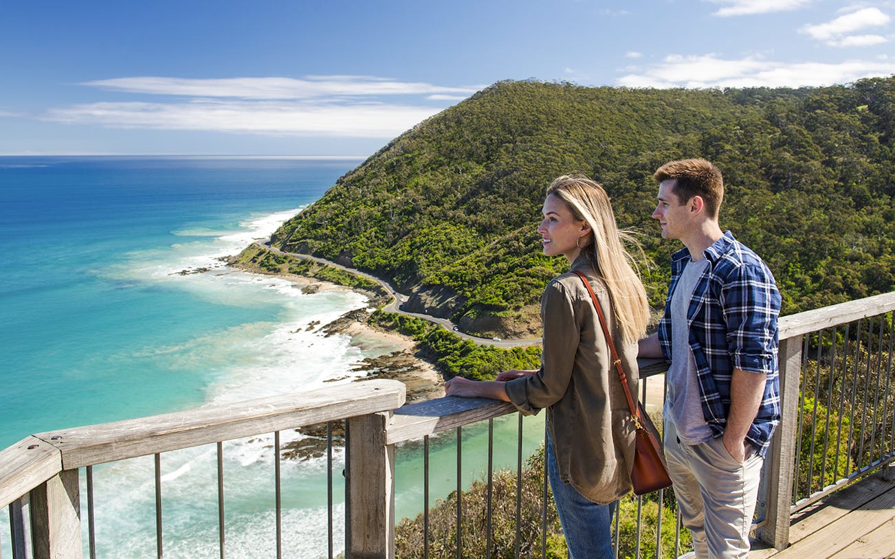 Couple enjoying the view from Teddy's Lookout on the Great Ocean Road.