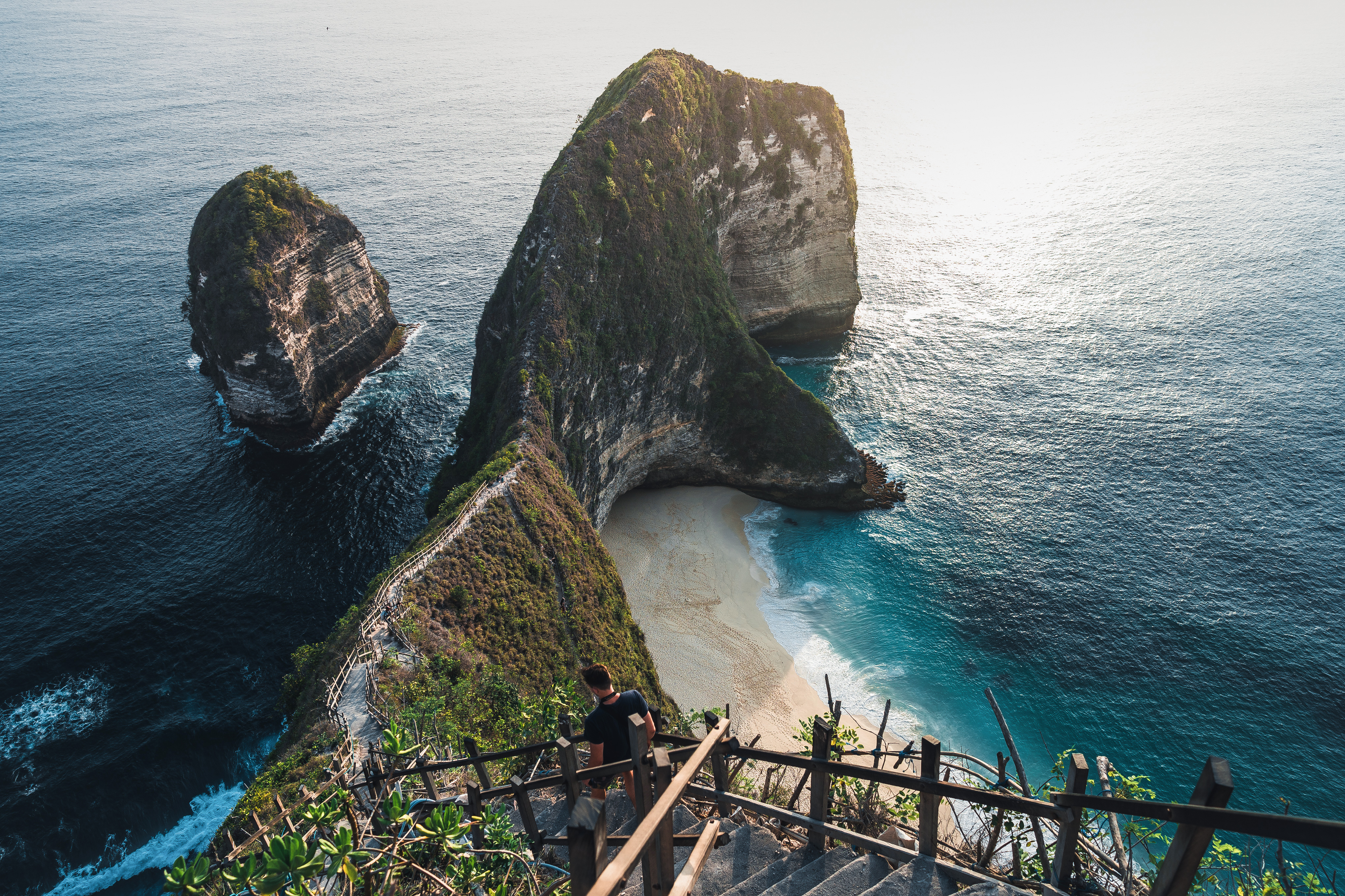 Viewpoint overlooking Kelingking Beach, Nusa Penida, with cliffs and ocean.