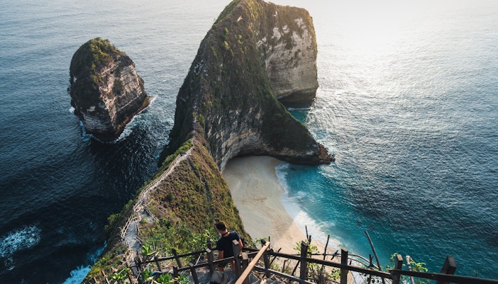Viewpoint overlooking Kelingking Beach, Nusa Penida, with cliffs and ocean.