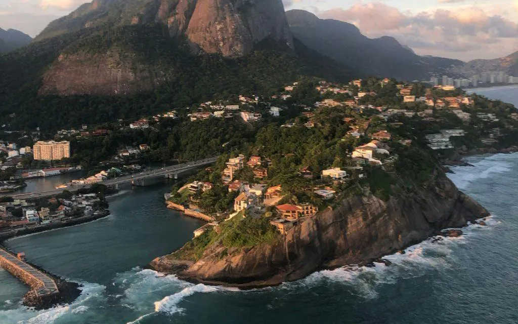 Aerial view of Rio de Janeiro coastline during sunset from VIP helicopter tour.