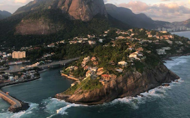 Aerial view of Rio de Janeiro coastline during sunset from VIP helicopter tour.