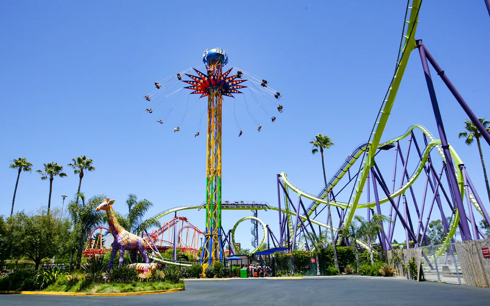 SkyScreamer ride at Discovery Kingdom, Six Flags, California with roller coasters in the background.