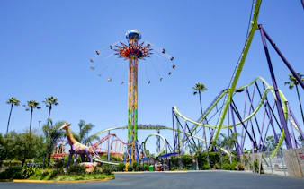 SkyScreamer ride at Discovery Kingdom, Six Flags, California with roller coasters in the background.