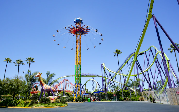 SkyScreamer ride at Discovery Kingdom, Six Flags, California with roller coasters in the background.