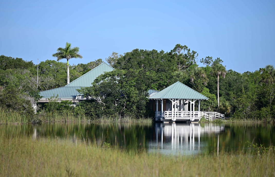 Ernest Coe Visitor Center entrance with informational signs in Everglades National Park.