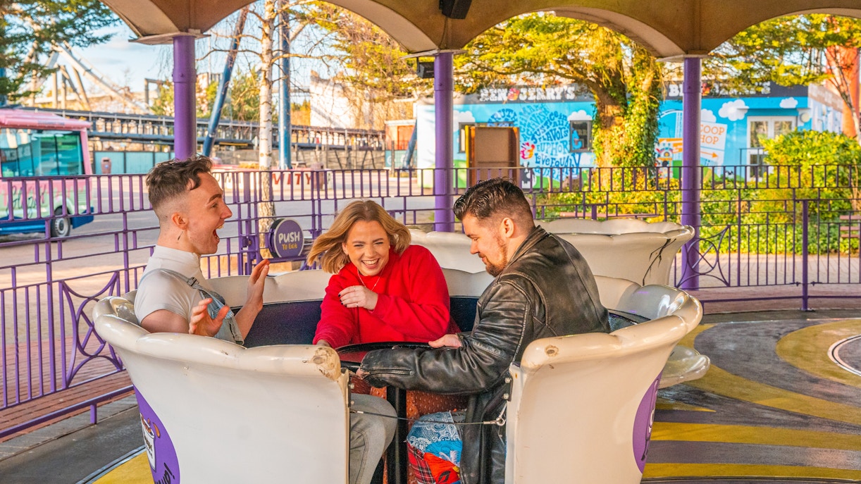 People enjoying a teacup ride at Thorpe Park.