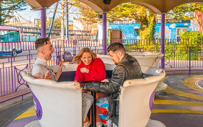 People enjoying a teacup ride at Thorpe Park.