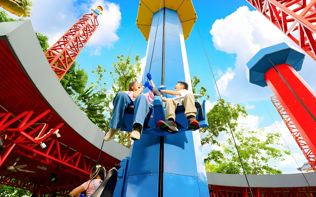 Mother and son enjoying a ride at LEGOLAND Malaysia Theme Park.