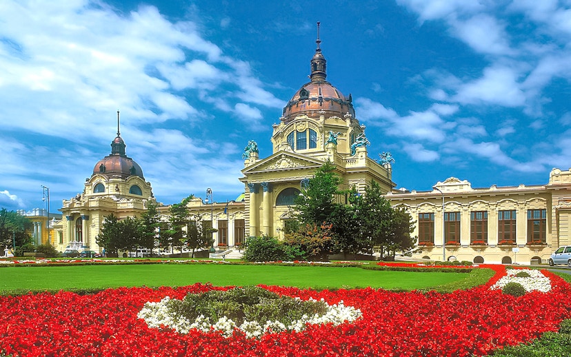 Szechenyi Bath exterior with domes and gardens in Budapest, Hungary.