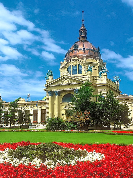 Szechenyi Bath exterior with domes and gardens in Budapest, Hungary.