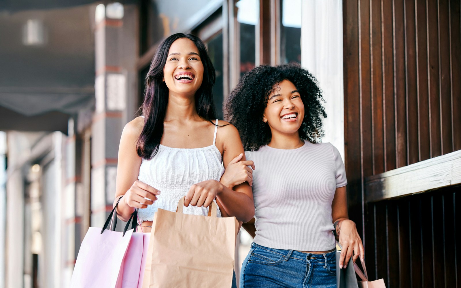 Guests enjoying shopping at American Dream with shopping bags.