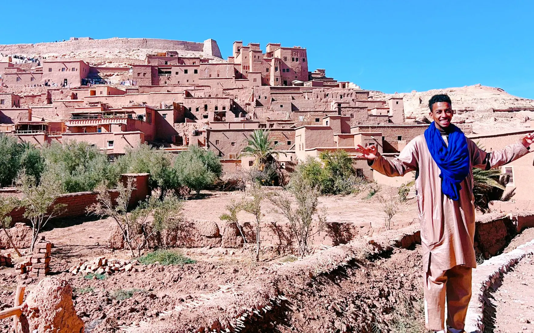 Man in traditional attire at Ait Benhaddou, Morocco, part of 3 Days Desert Tour to Merzouga Dunes.