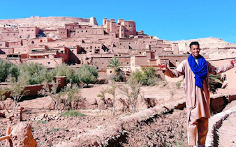 Man in traditional attire at Ait Benhaddou, Morocco, part of 3 Days Desert Tour to Merzouga Dunes.