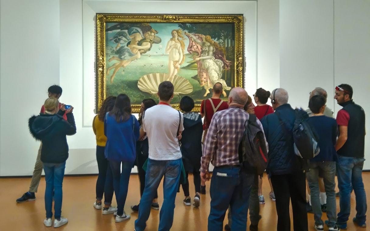 Tourists viewing Botticelli's 'The Birth of Venus' at Uffizi Gallery, Florence.