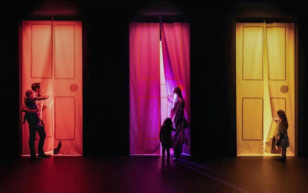 Visitors exploring colorful doorways at Mirror Mirror exhibit, ArtScience Museum.