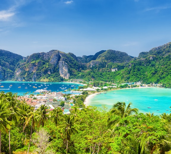 Phi Phi Island view with turquoise waters and lush hills, Phuket to Phi Phi Island tours.