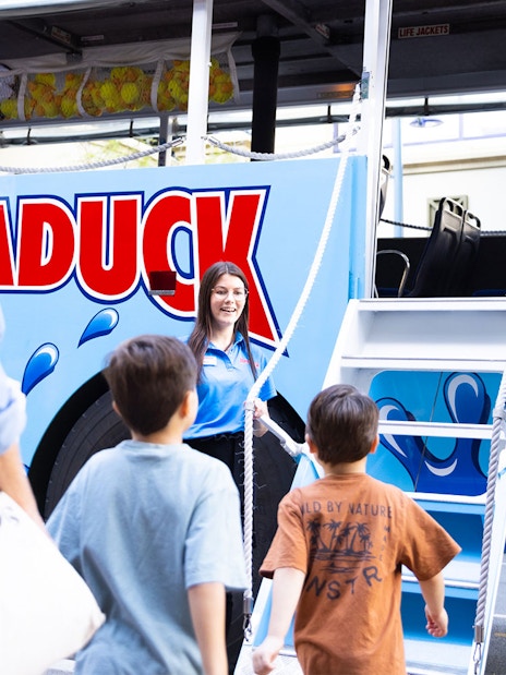 Guests boarding Aquaduck vehicle for Sunshine Coast city tour and river cruise.