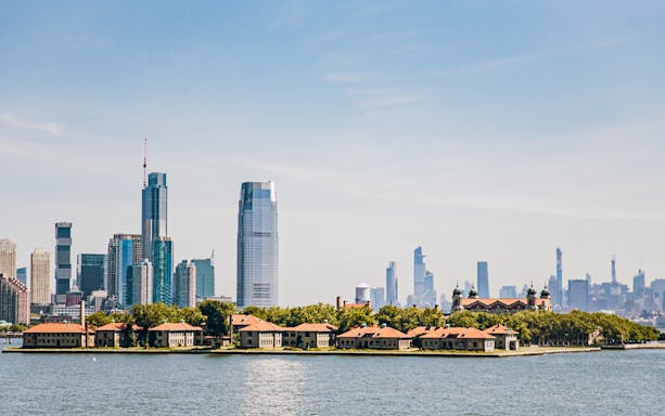 Ellis Island with New York City skyline in the background.