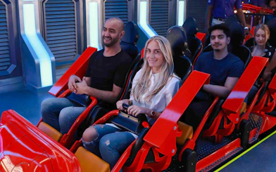 People on a roller coaster at Doha Quest, Qatar.