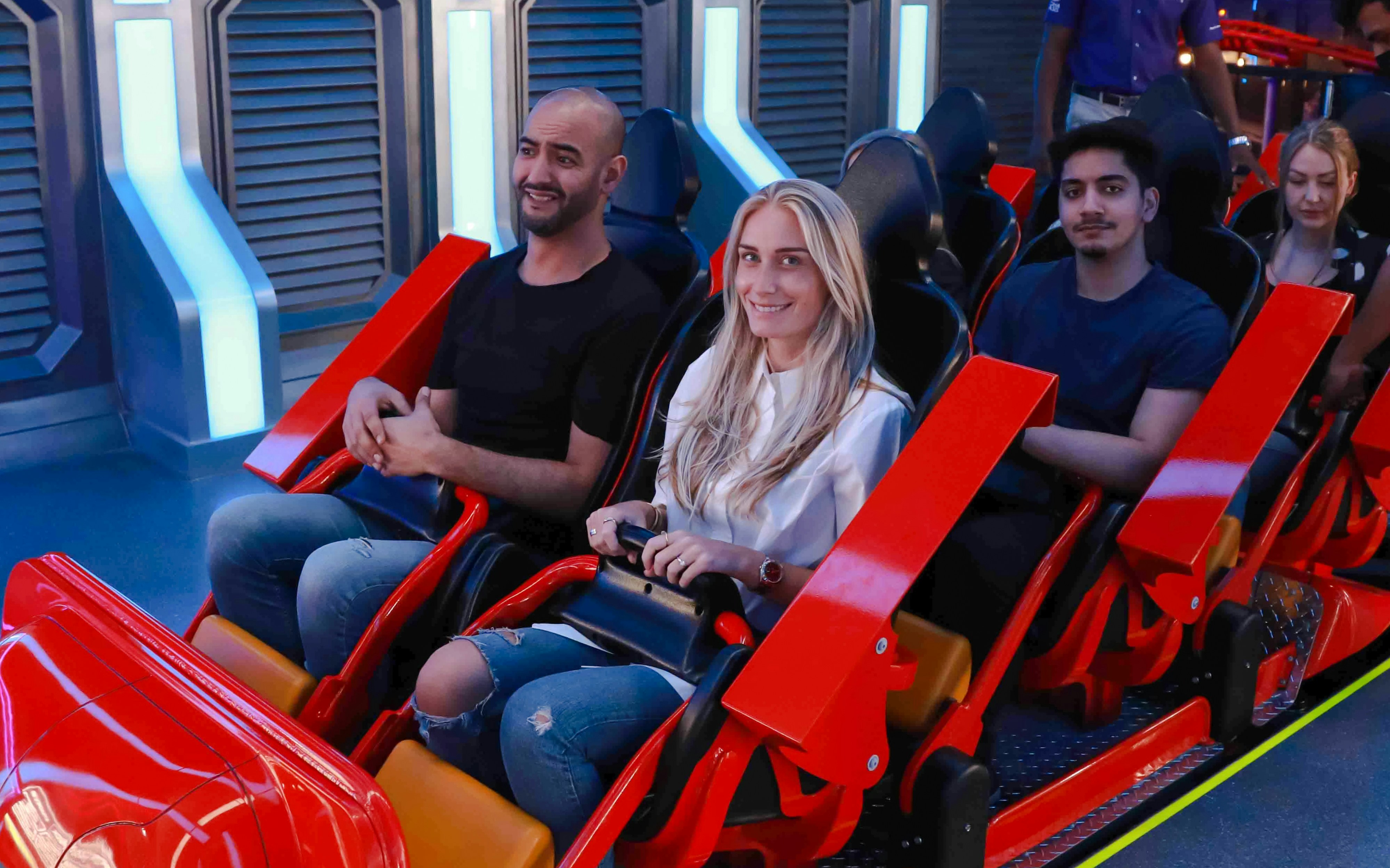 People on a roller coaster at Doha Quest, Qatar.