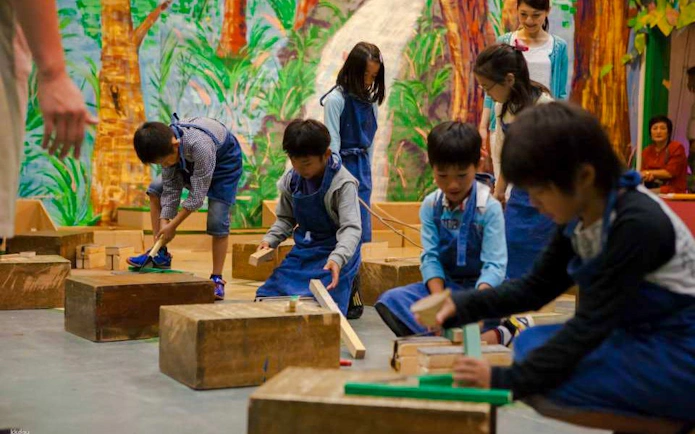 Children engaging in hands-on activities at Kids Plaza Osaka.