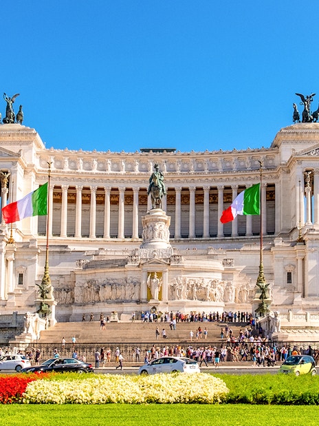 Victor Emmanuel II Monument with Italian flags at Venice Square, Rome.