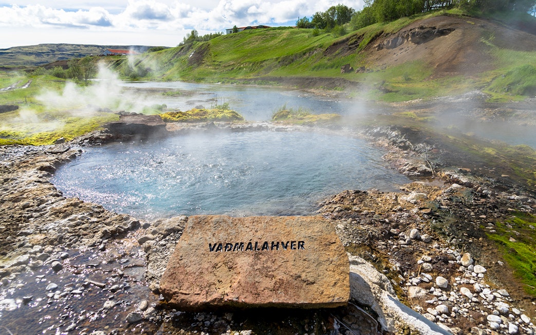 Geothermal pool with steam rising, Golden Circle tour, Iceland.