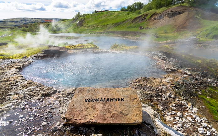 Geothermal pool with steam rising, Golden Circle tour, Iceland.