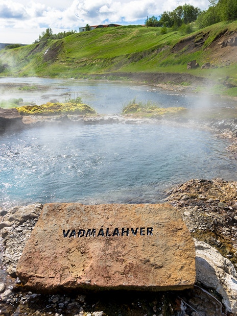 Geothermal pool with steam rising, Golden Circle tour, Iceland.