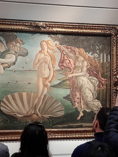 Visitors viewing Botticelli's Birth of Venus at Uffizi Gallery, Florence.