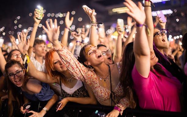 Crowd enjoying UNTOLD Music Festival in Dubai at night.